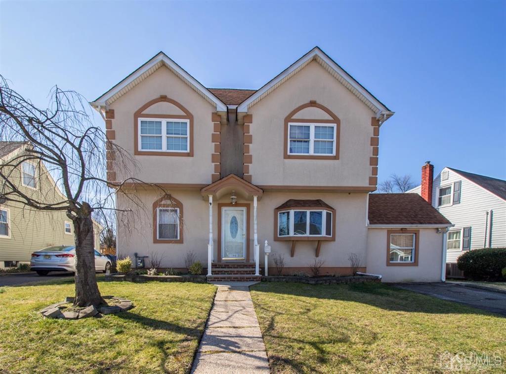 190 Midfield Road Colonia, NJ 07067 - Photo 1 of 17 a front view of a house with a yard
