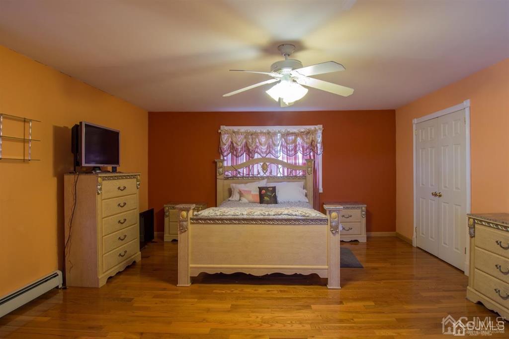 190 Midfield Road Colonia, NJ 07067 - Photo 11 of 17 a living room with furniture and flat screen tv