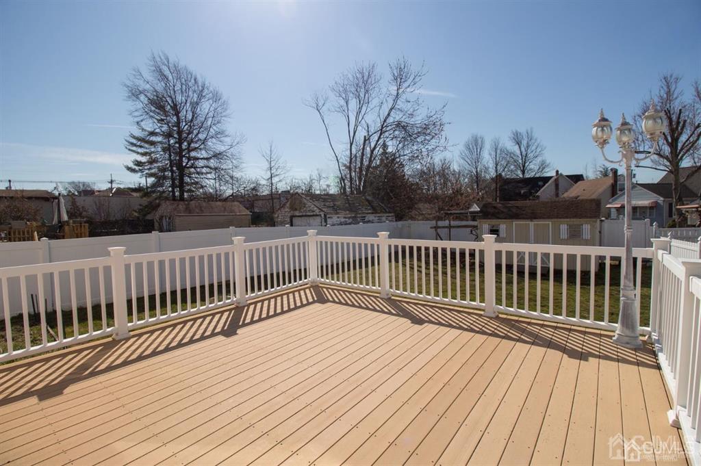 190 Midfield Road Colonia, NJ 07067 - Photo 16 of 17 a view of deck with wooden floor and fence