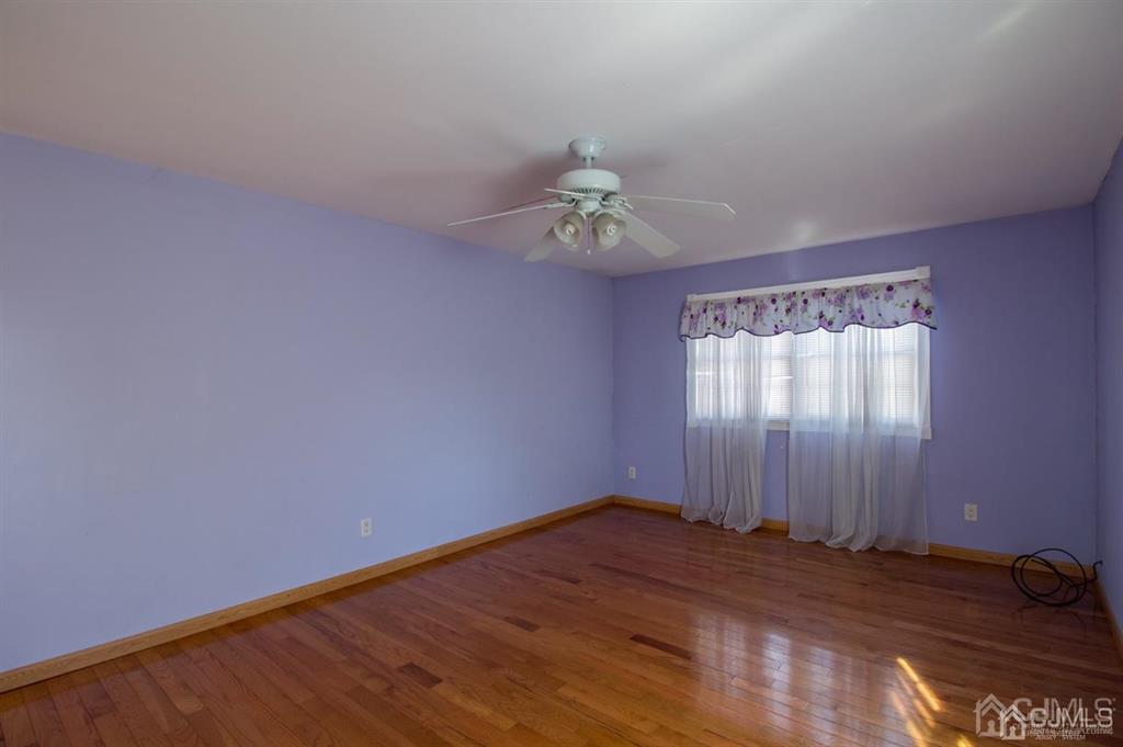 190 Midfield Road Colonia, NJ 07067 - Photo 9 of 17 a view of a room with a window and wooden floor