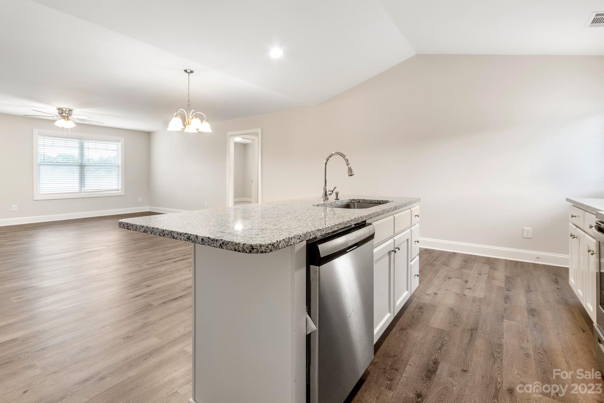 1509 Rehobeth Church Road Shelby, NC 28150 - Photo 12 of 34 a kitchen with a sink cabinets and wooden floor