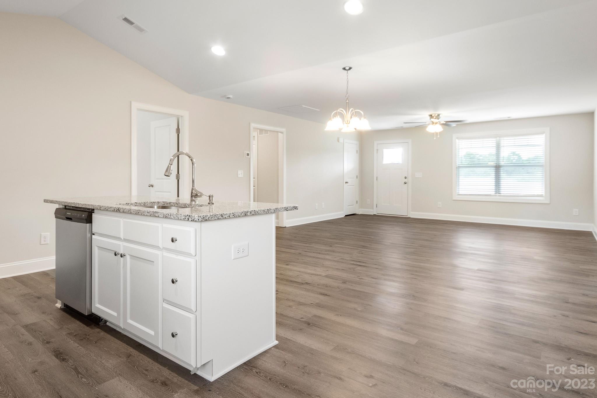 1509 Rehobeth Church Road Shelby, NC 28150 - Photo 13 of 34 an empty room with wooden floor and windows