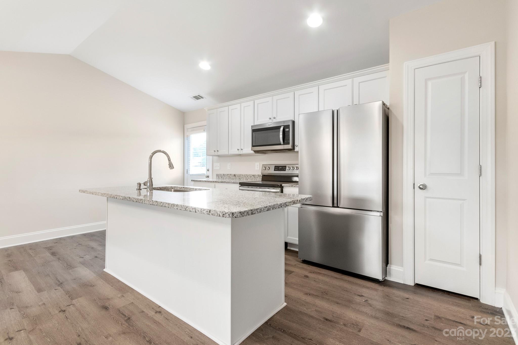 1509 Rehobeth Church Road Shelby, NC 28150 - Photo 14 of 34 a kitchen with stainless steel appliances granite countertop a refrigerator sink and microwave