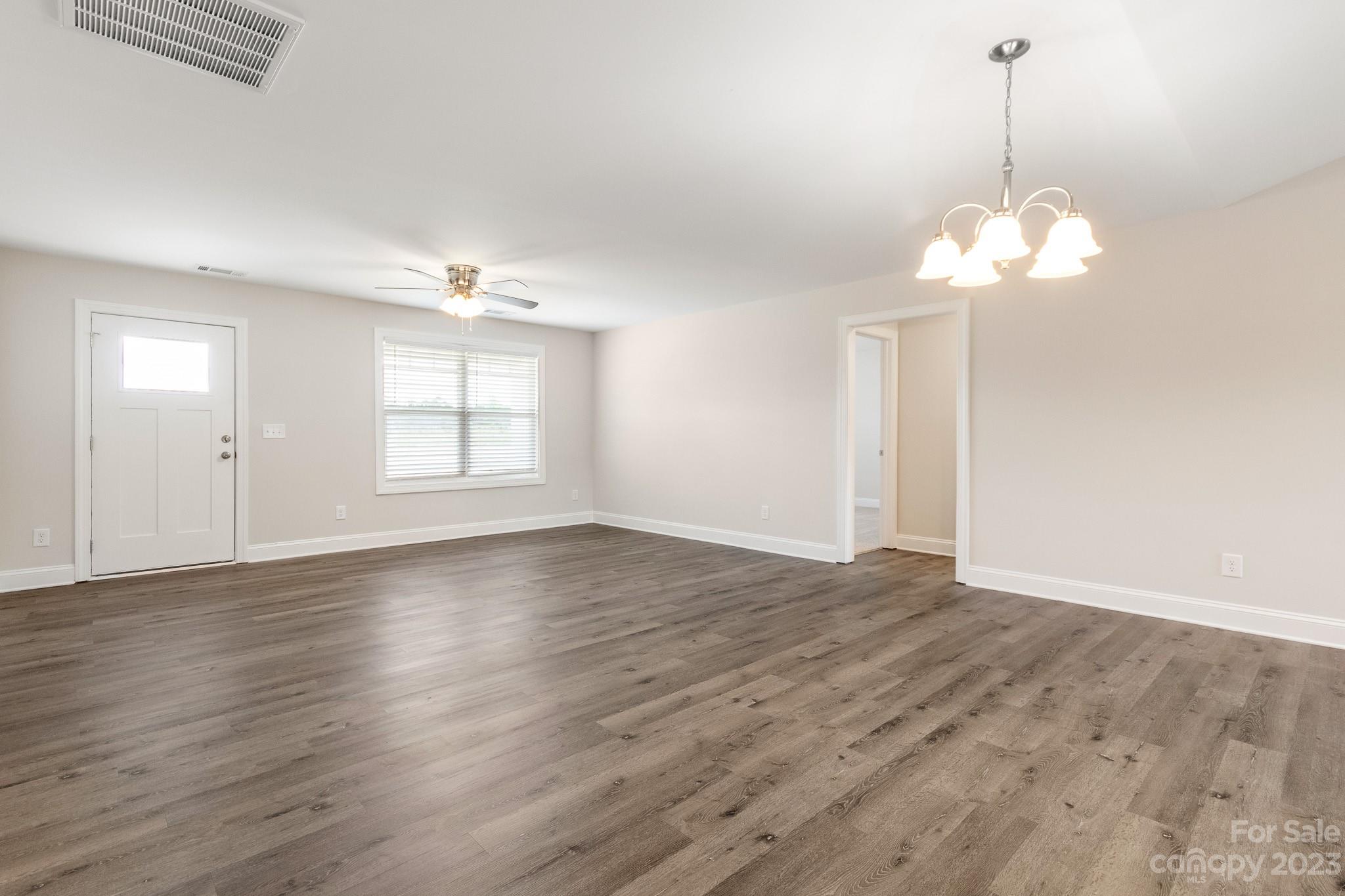 1509 Rehobeth Church Road Shelby, NC 28150 - Photo 15 of 34 a view of wooden floor chandelier and window in a room