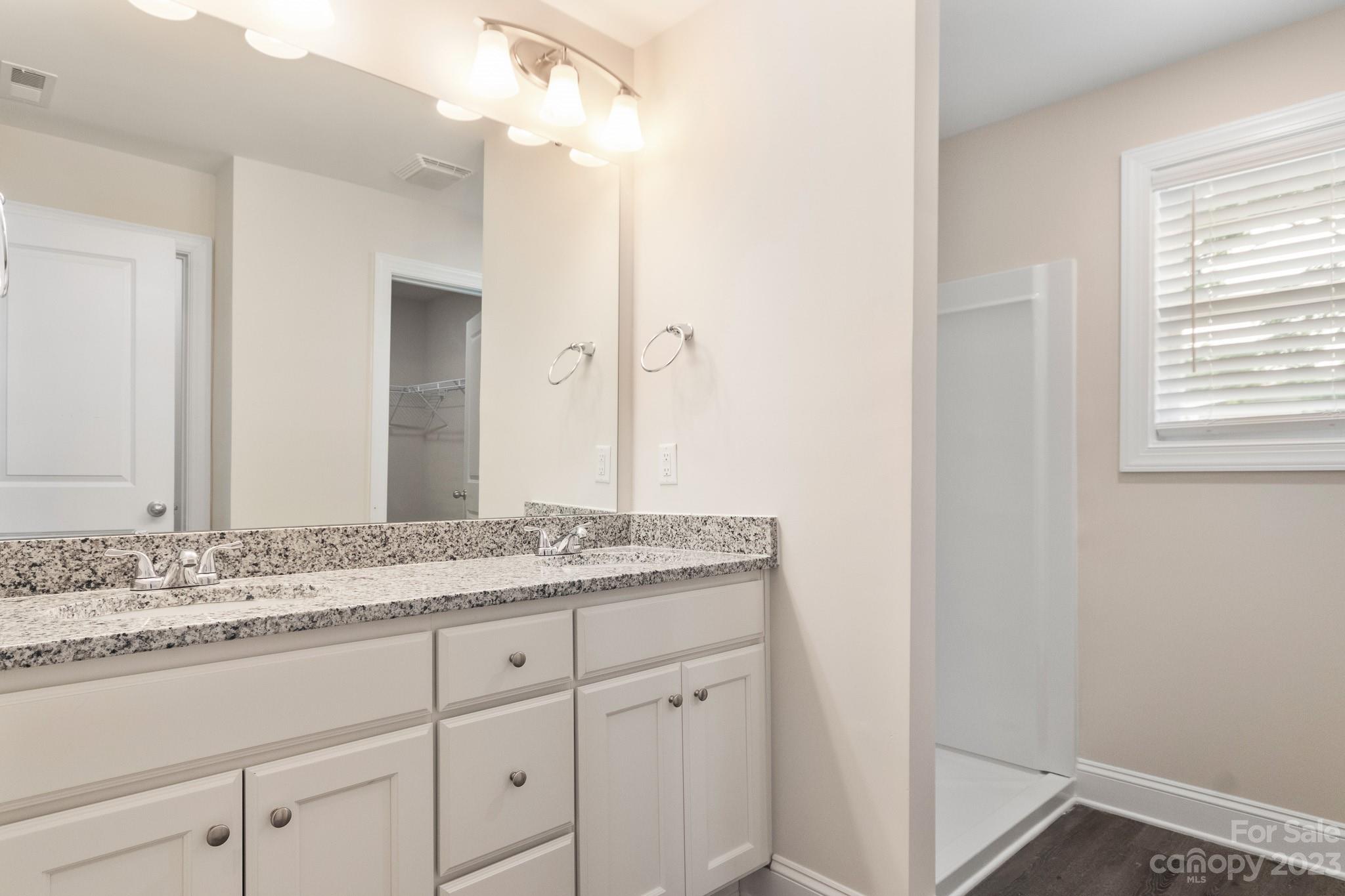 1509 Rehobeth Church Road Shelby, NC 28150 - Photo 20 of 34 a bathroom with a granite countertop sink and a mirror
