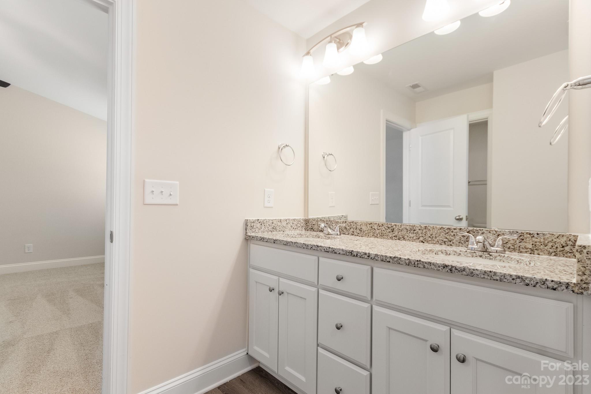 1509 Rehobeth Church Road Shelby, NC 28150 - Photo 24 of 34 a bathroom with a granite countertop sink and a mirror