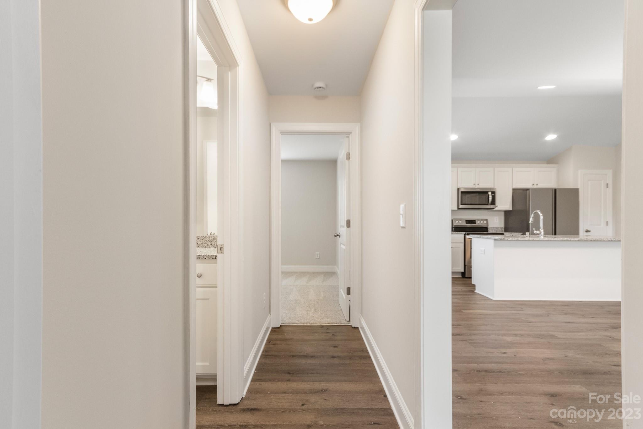 1509 Rehobeth Church Road Shelby, NC 28150 - Photo 27 of 34 a view of a hallway with wooden floor and kitchen