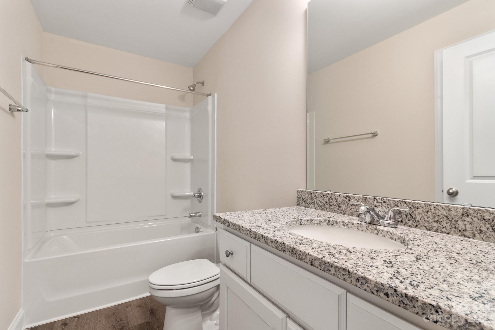1509 Rehobeth Church Road Shelby, NC 28150 - Photo 30 of 34 a bathroom with a granite countertop sink a toilet and shower