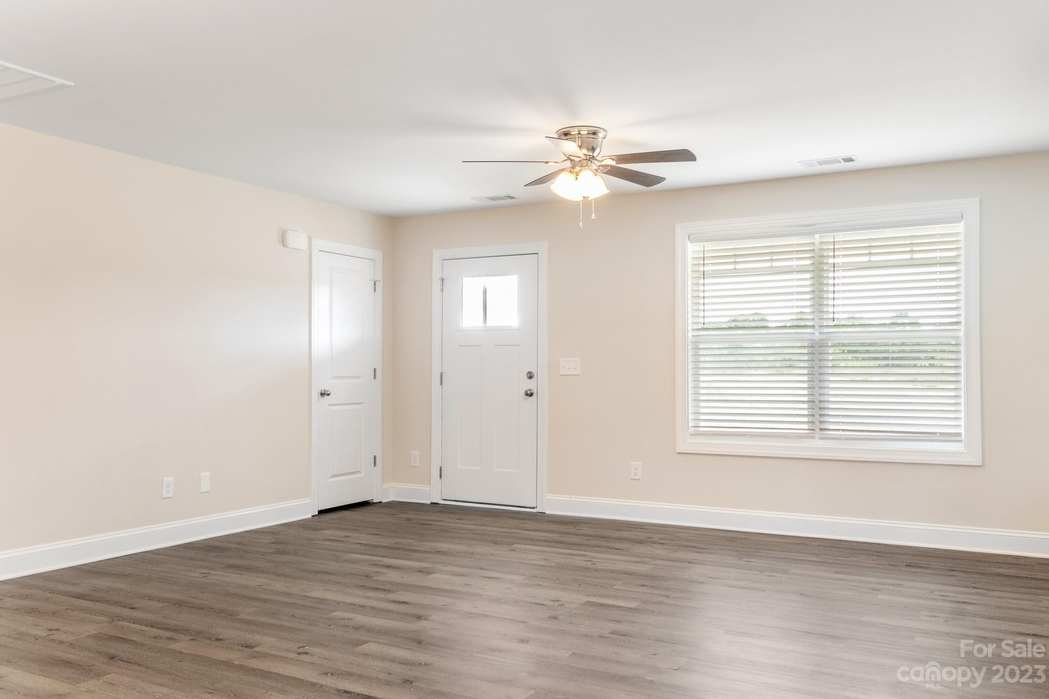 1509 Rehobeth Church Road Shelby, NC 28150 - Photo 4 of 34 a view of an empty room with wooden floor and a window