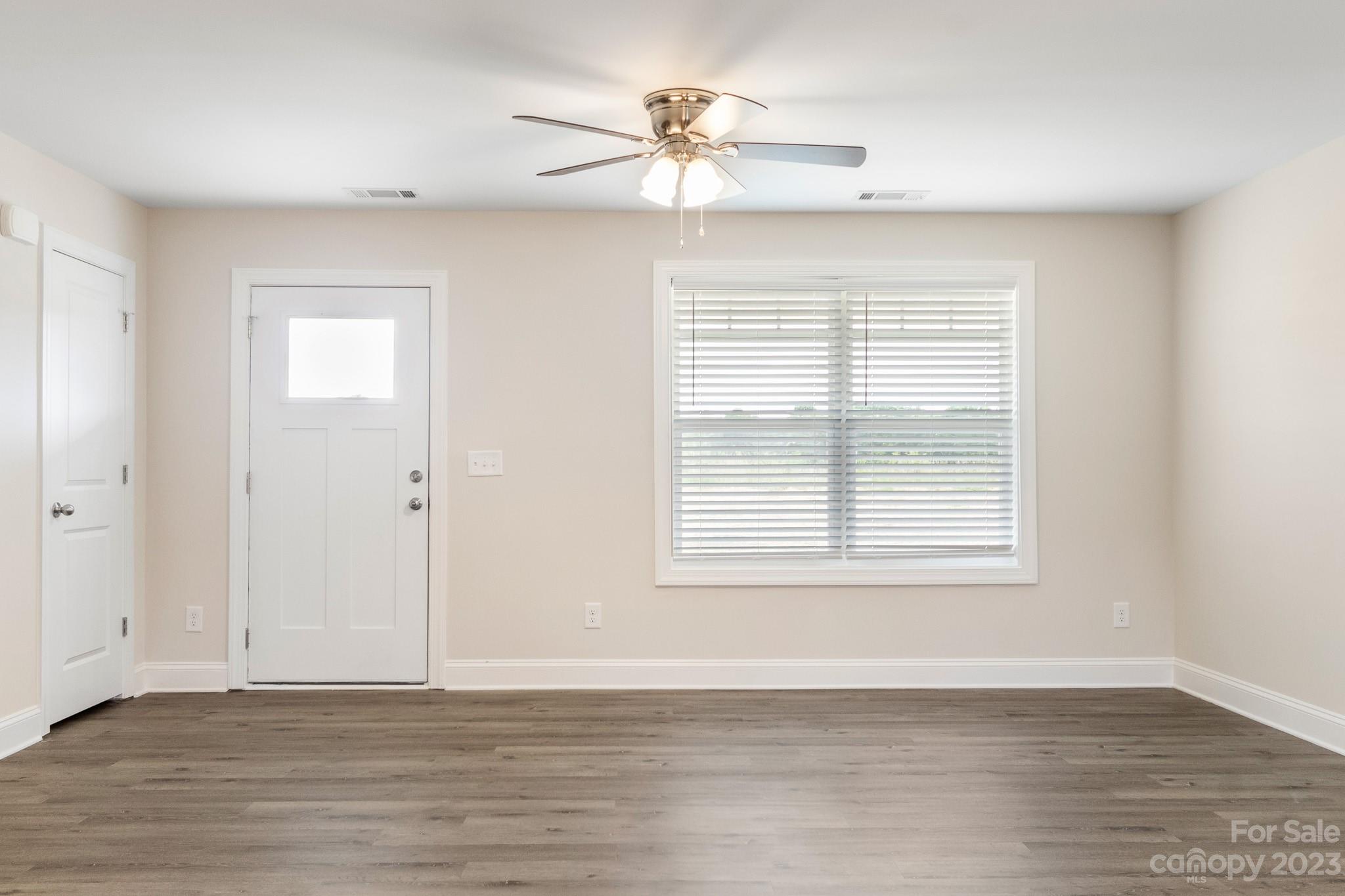 1509 Rehobeth Church Road Shelby, NC 28150 - Photo 5 of 34 a view of an empty room with wooden floor and a window