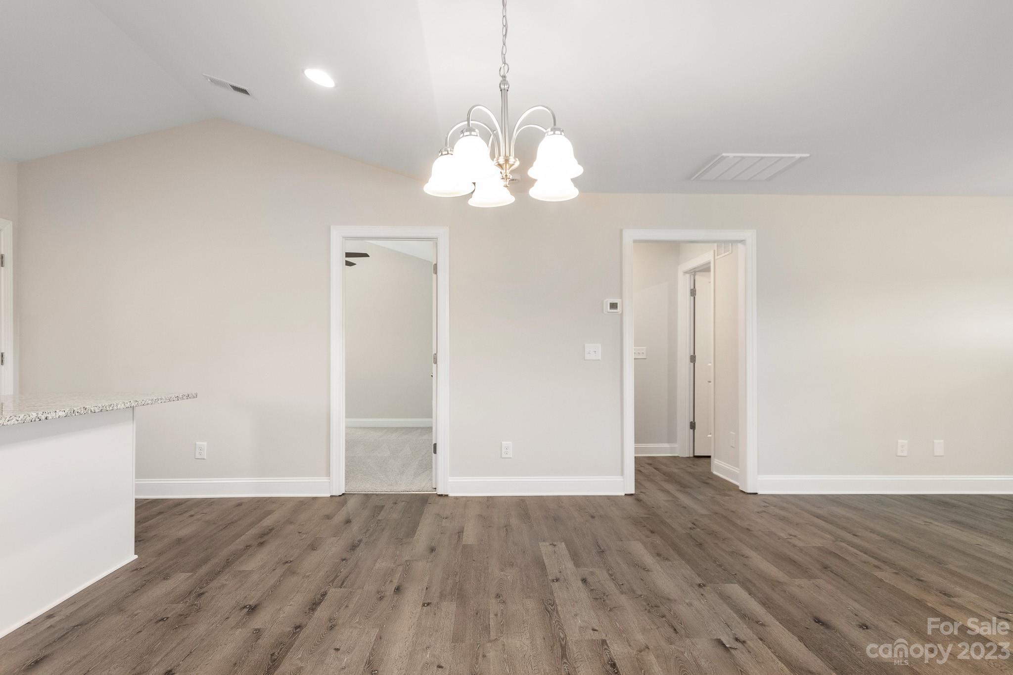 1509 Rehobeth Church Road Shelby, NC 28150 - Photo 8 of 34 a view of a chandelier fan and wooden floor