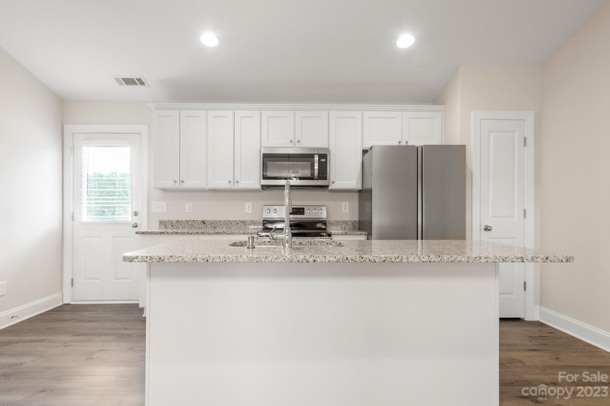 1509 Rehobeth Church Road Shelby, NC 28150 - Photo 10 of 34 a kitchen with stainless steel appliances granite countertop a refrigerator a stove and a sink