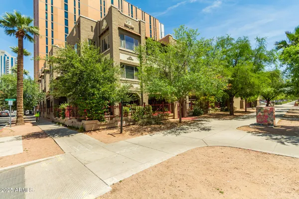 a view of a building with trees in the background