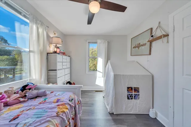 a bedroom with bed and a window