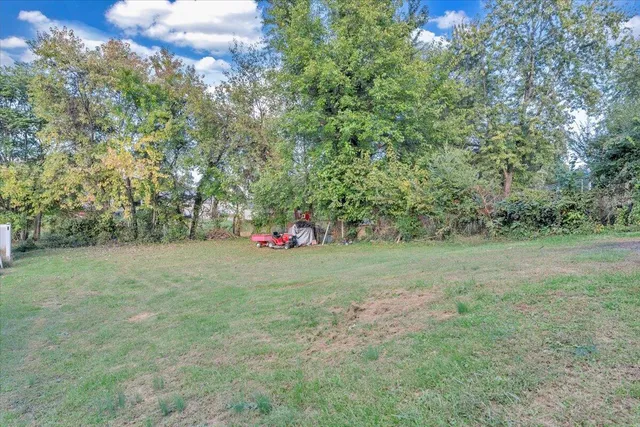 a house view with a sitting space and garden
