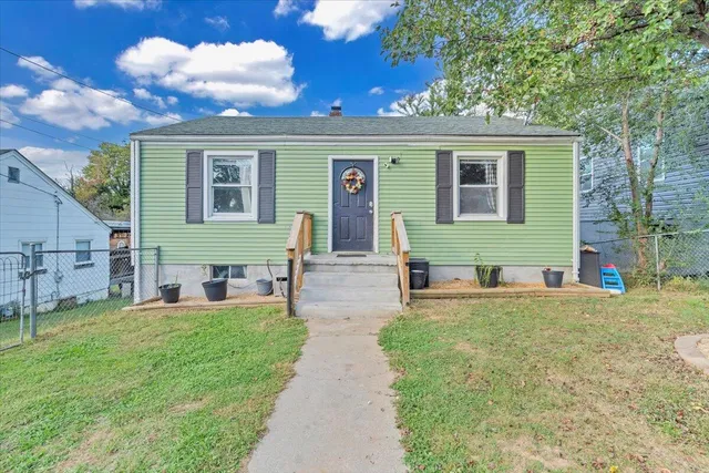 a balcony with furniture and a potted plant