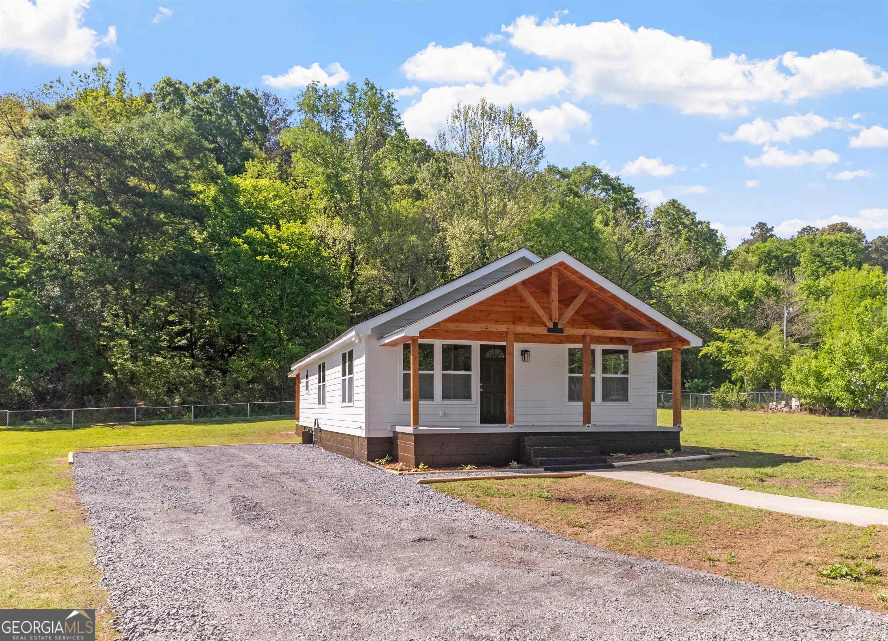 1520 Old Cave Spring Road Southwest Rome, GA 30161 - Photo 1 of 1 a view of a house with a swimming pool and a yard