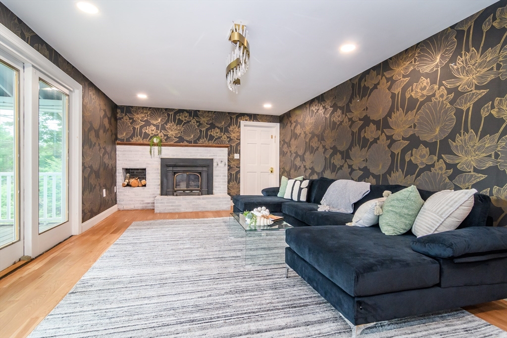 124 Everett Street Natick, MA 01760 - Photo 15 of 36 a living room with furniture and a fireplace