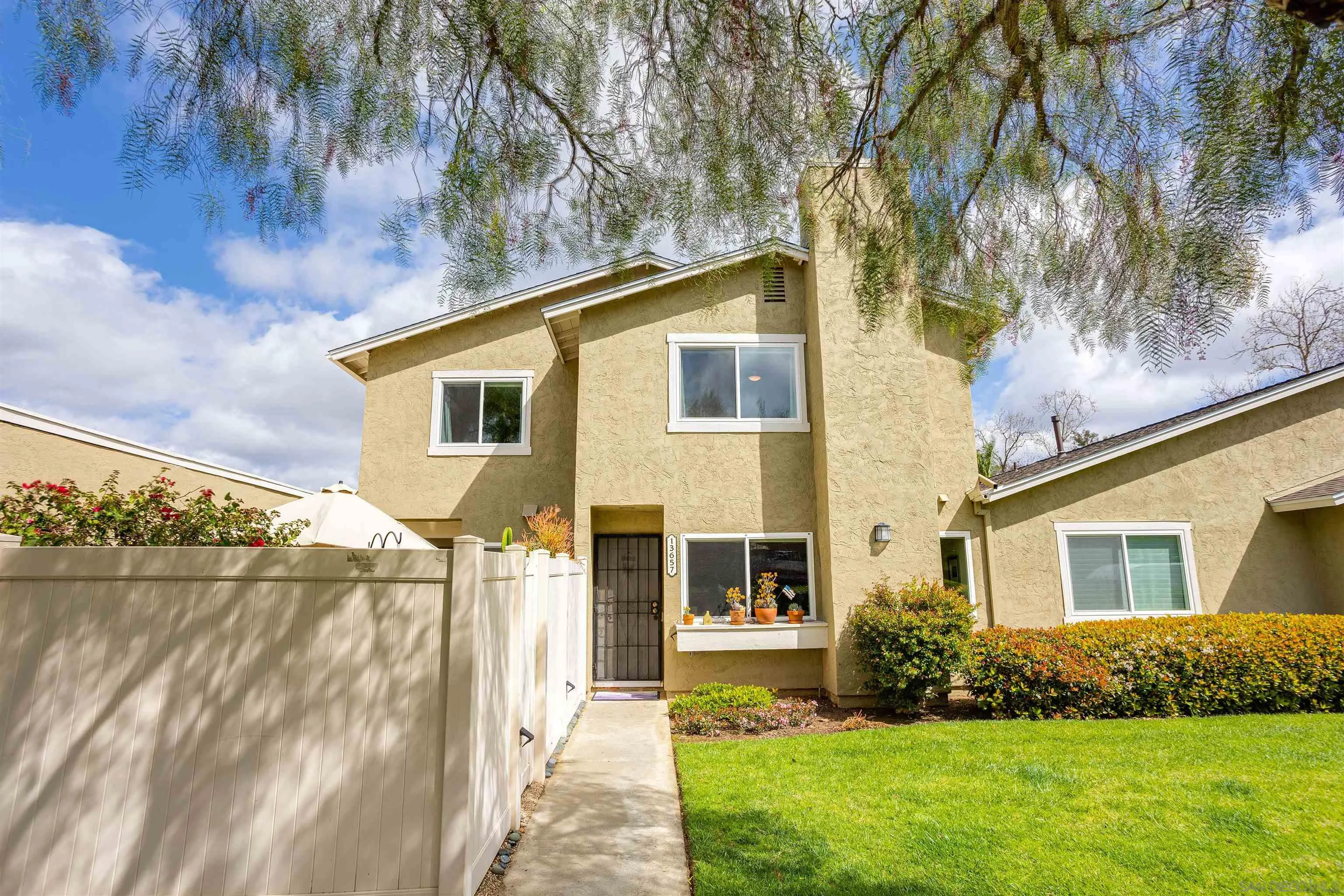 13657 Comuna Drive Poway, CA 92064 - Photo 1 of 36 a front view of a house with garden