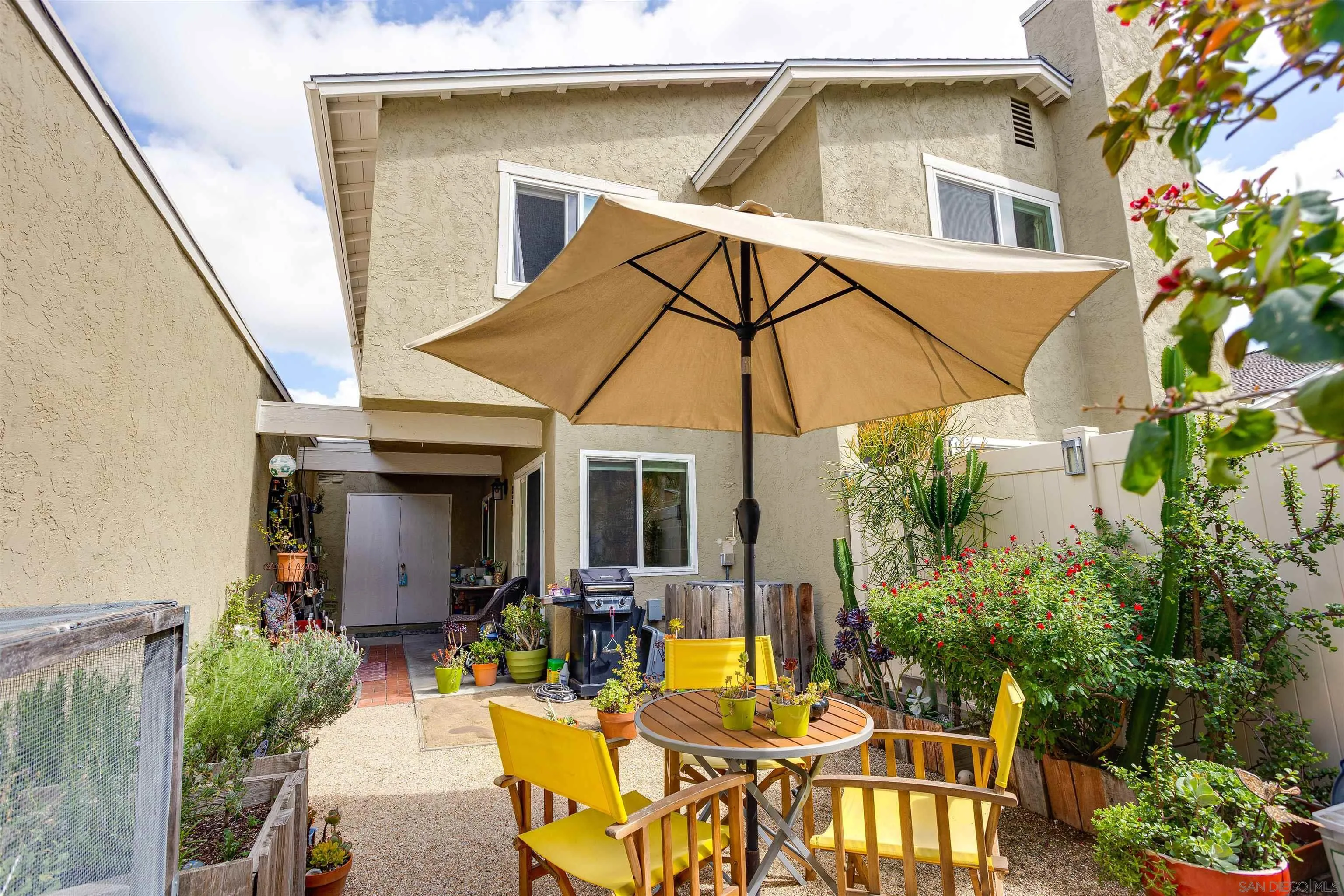 13657 Comuna Drive Poway, CA 92064 - Photo 20 of 36 a view of a house with pool and chairs