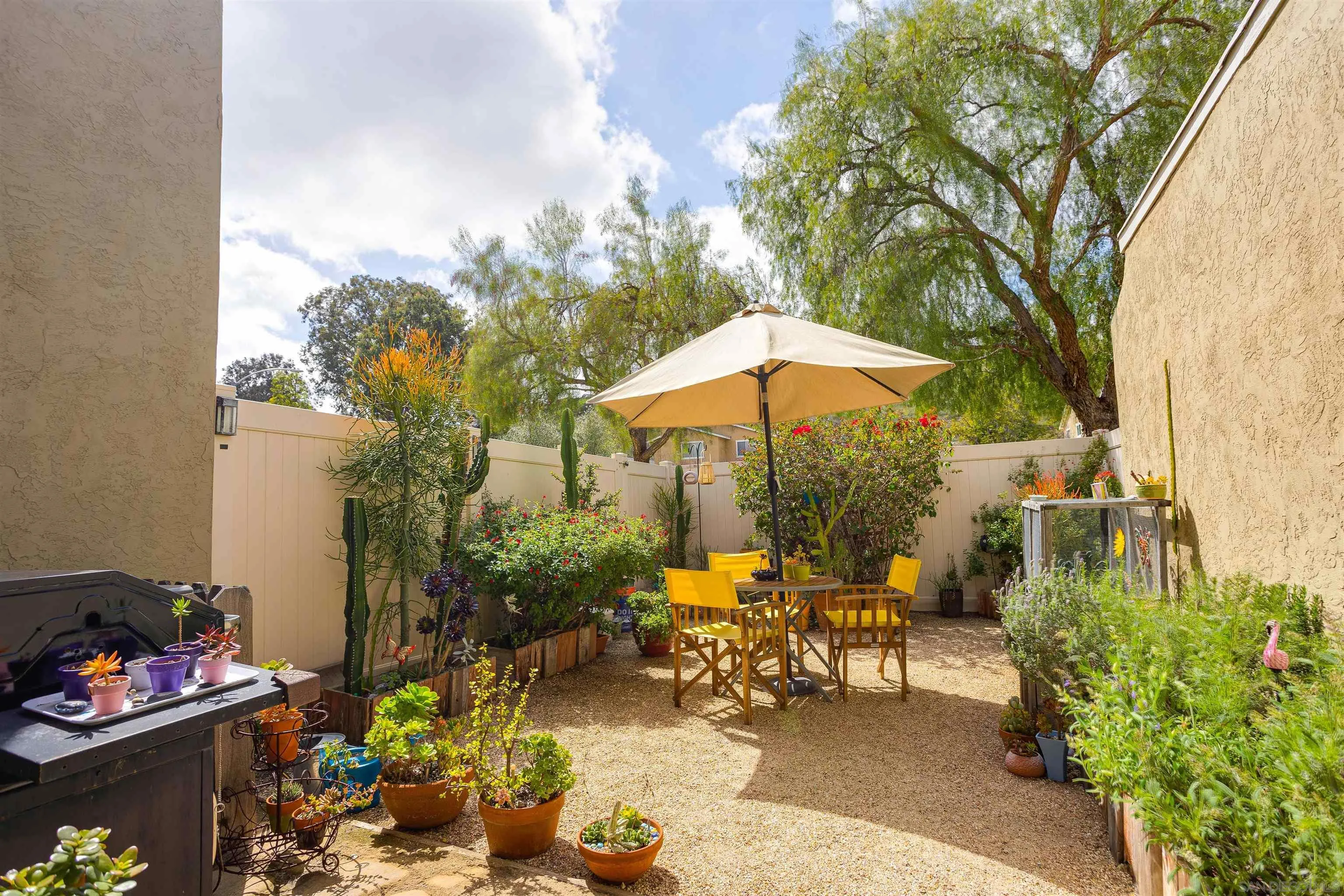 13657 Comuna Drive Poway, CA 92064 - Photo 24 of 36 a view of a backyard with sitting area and furniture