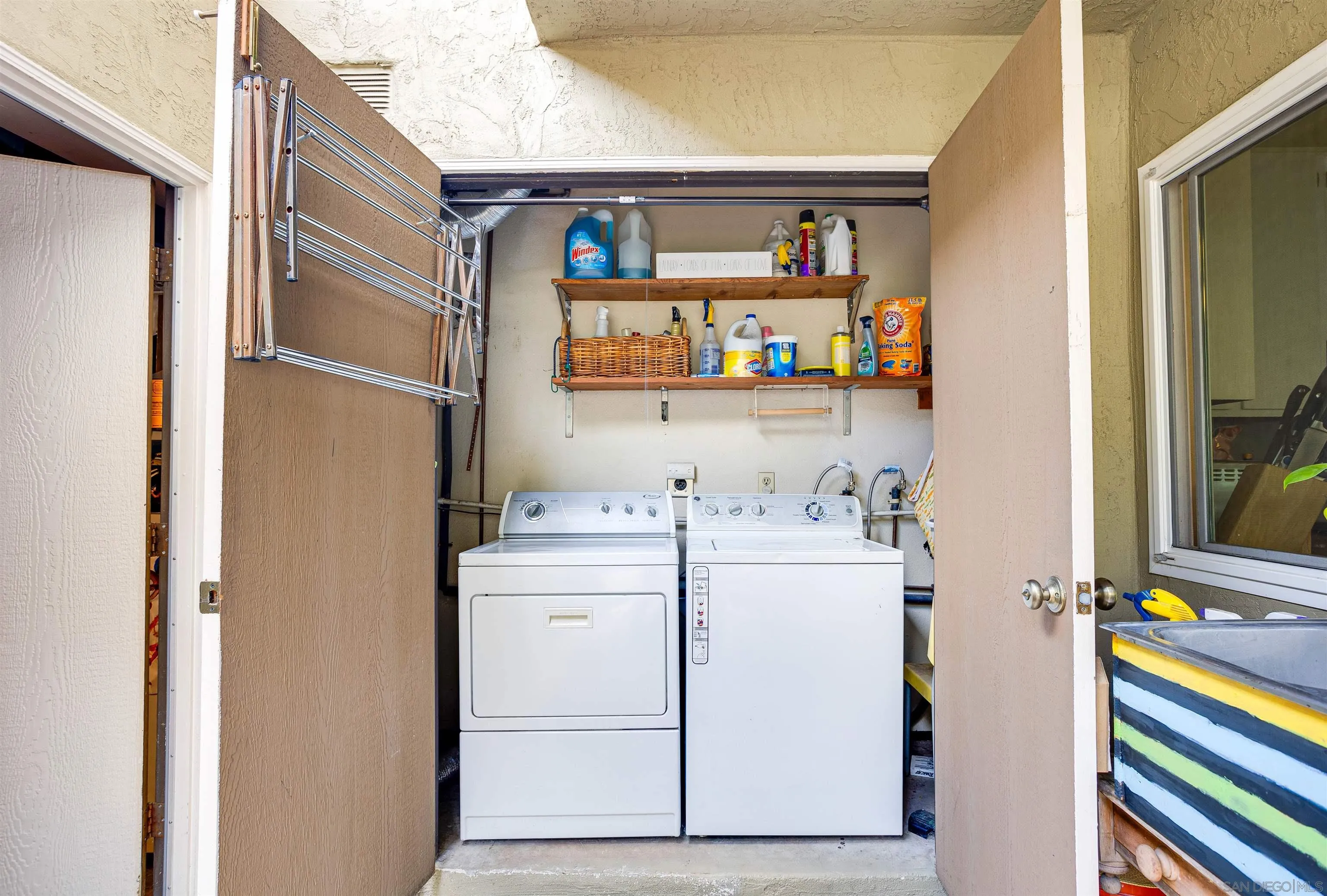 13657 Comuna Drive Poway, CA 92064 - Photo 25 of 36 a utility room with dryer and washer
