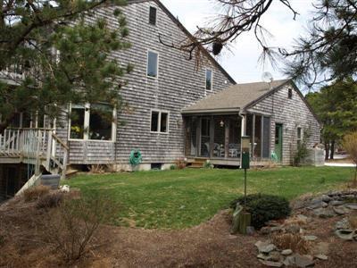 114 Shore Road Truro, MA 02666 - Photo 1 of 30 a front view of a house with a garden