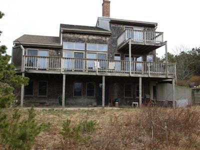 114 Shore Road Truro, MA 02666 - Photo 17 of 30 a front view of a house with balcony