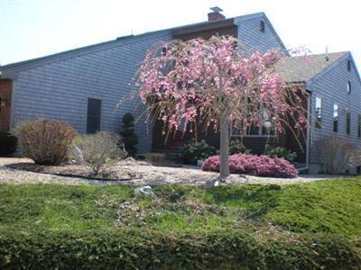 114 Shore Road Truro, MA 02666 - Photo 2 of 30 a front view of a house with garden