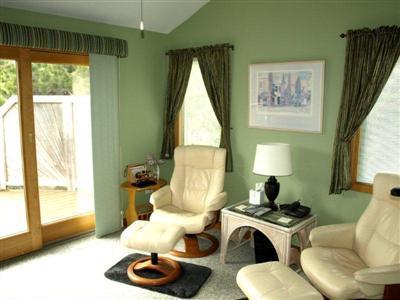 114 Shore Road Truro, MA 02666 - Photo 26 of 30 a living room with furniture and a large window