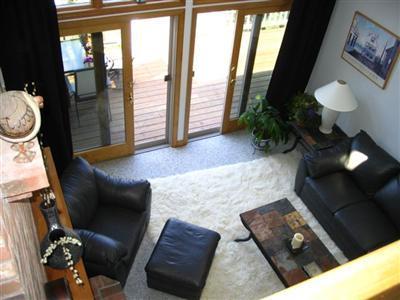 114 Shore Road Truro, MA 02666 - Photo 7 of 30 a living room with furniture and a floor to ceiling window