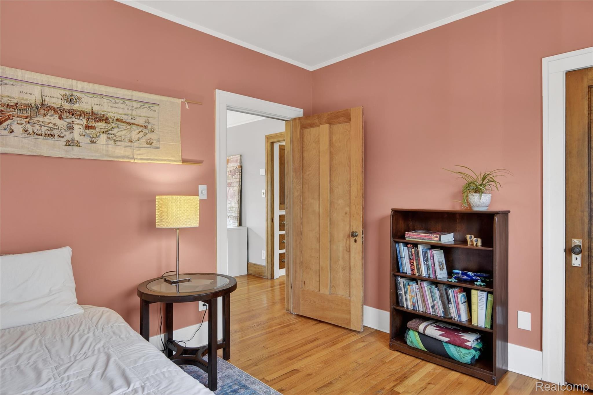 925 Nottingham Road Grosse Pointe, MI 48230 - Photo 23 of 46 Bedroom featuring ornamental molding and light wood-type flooring