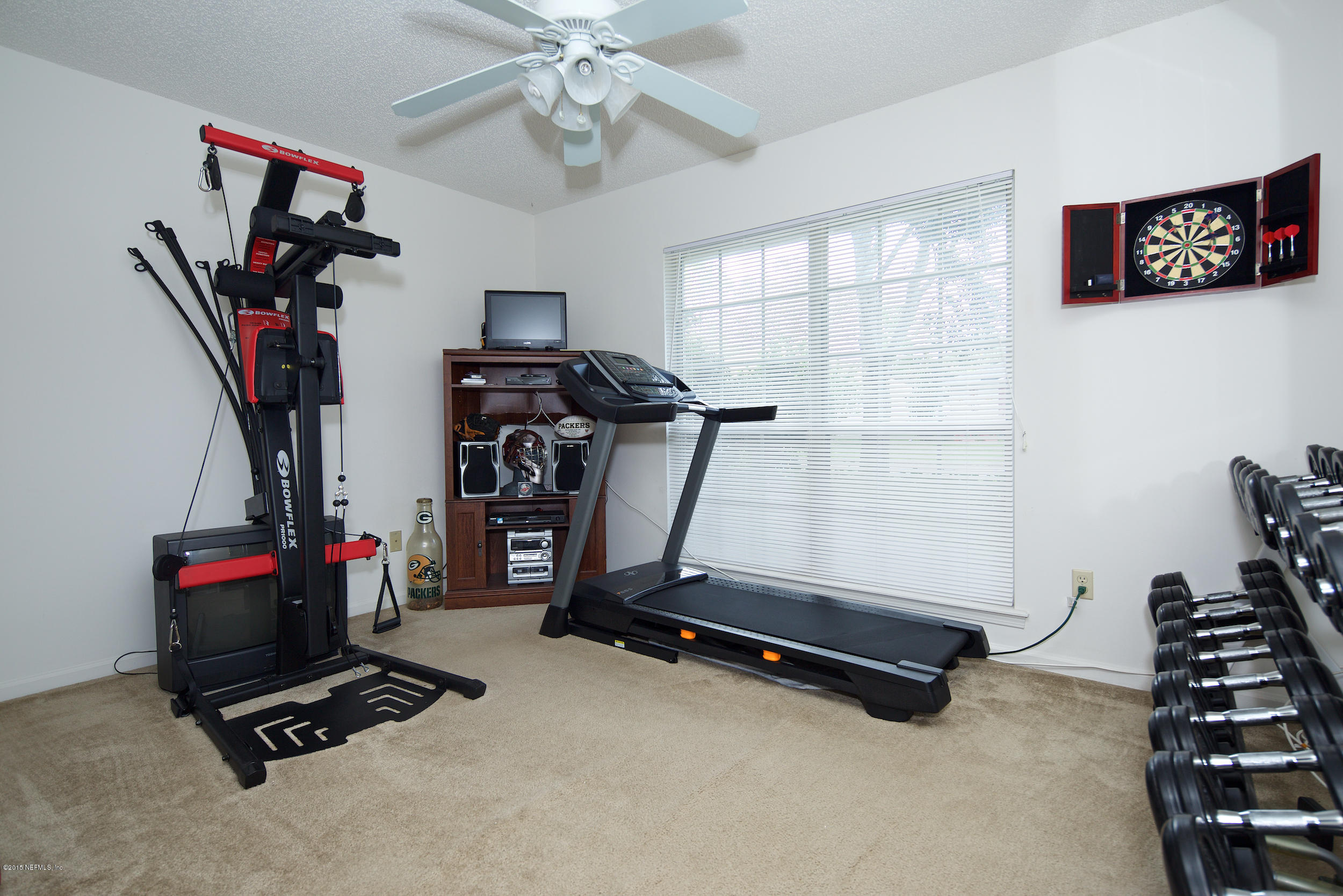 1645 Rusty Rail Road Jacksonville, FL 32225 - Photo 20 of 30 a view of a room with gym equipment