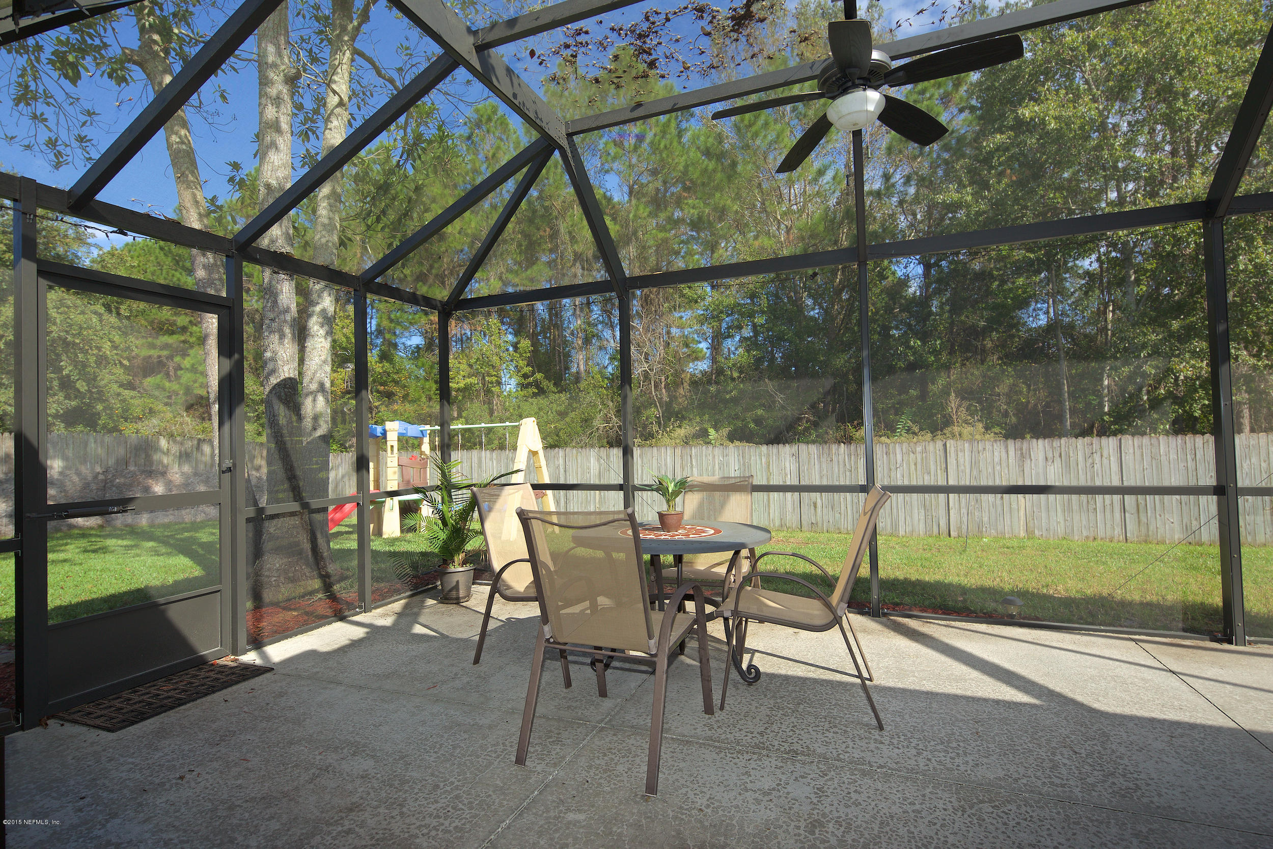 1645 Rusty Rail Road Jacksonville, FL 32225 - Photo 24 of 30 a view of a porch with chairs and backyard