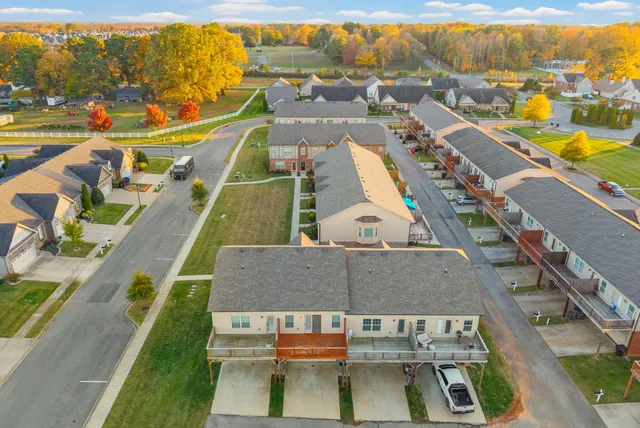 an aerial view of a house with sitting area