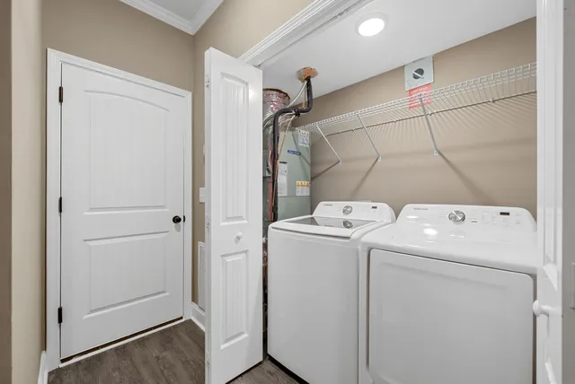 a view of storage and utility room with washer and dryer