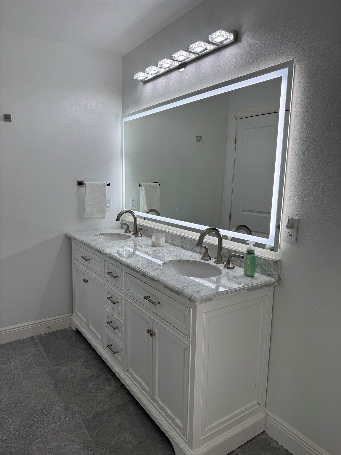 24879 Macedonia Road Hockley, TX 77447 - Photo 12 of 32 a bathroom with a granite countertop sink a large mirror and a
