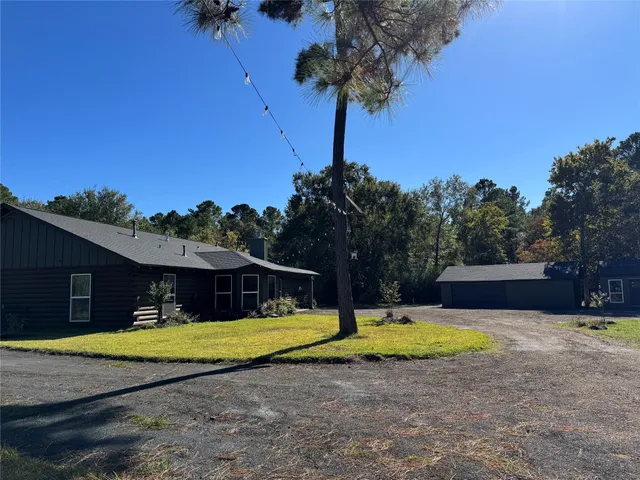a view of yard and tree