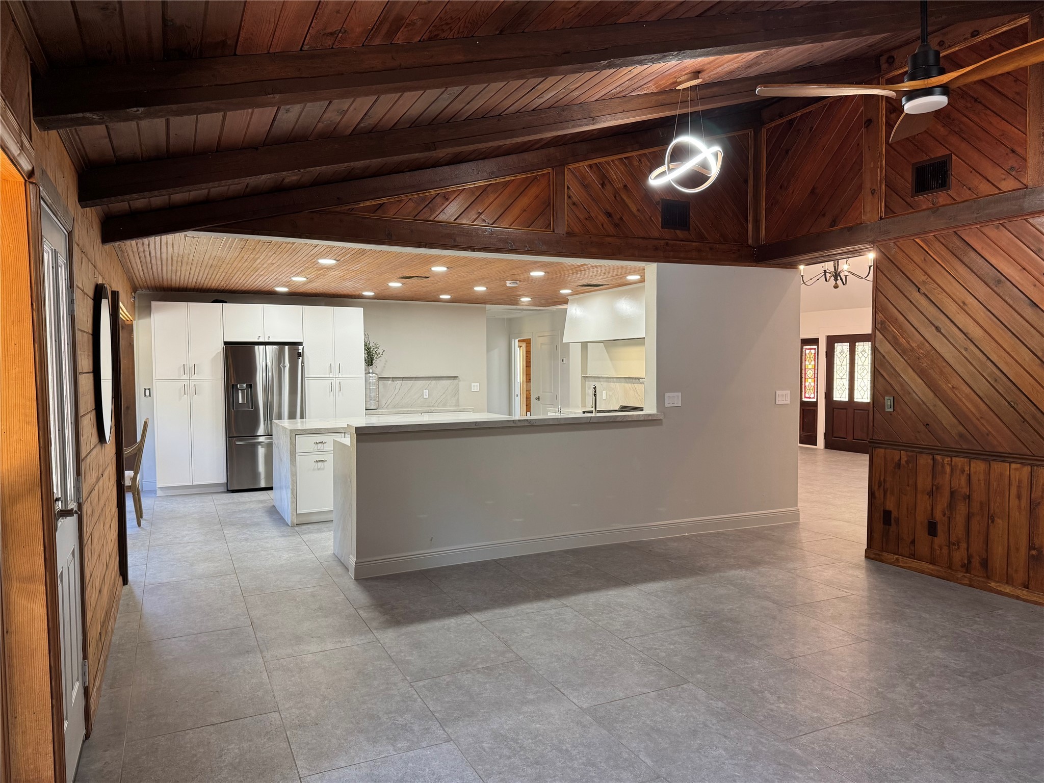 24879 Macedonia Road Hockley, TX 77447 - Photo 18 of 32 a view of a hallway with entryway and chandelier