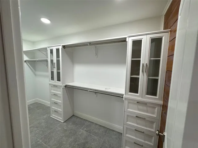 a view of a patio with table and chairs