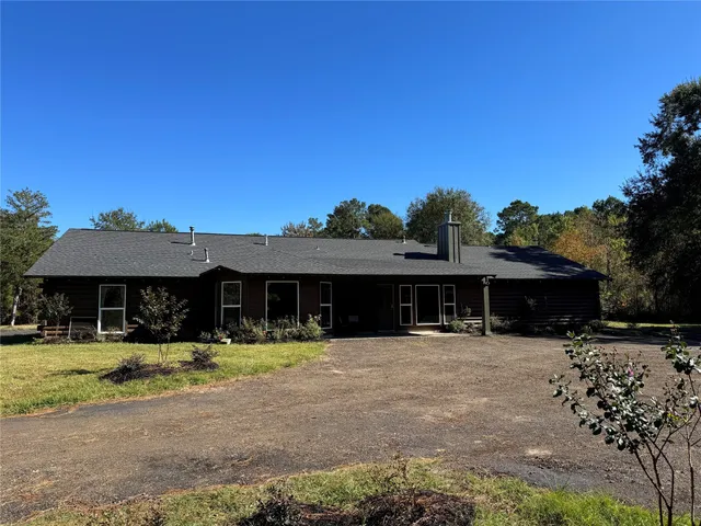 a view of a table and chairs under an umbrella
