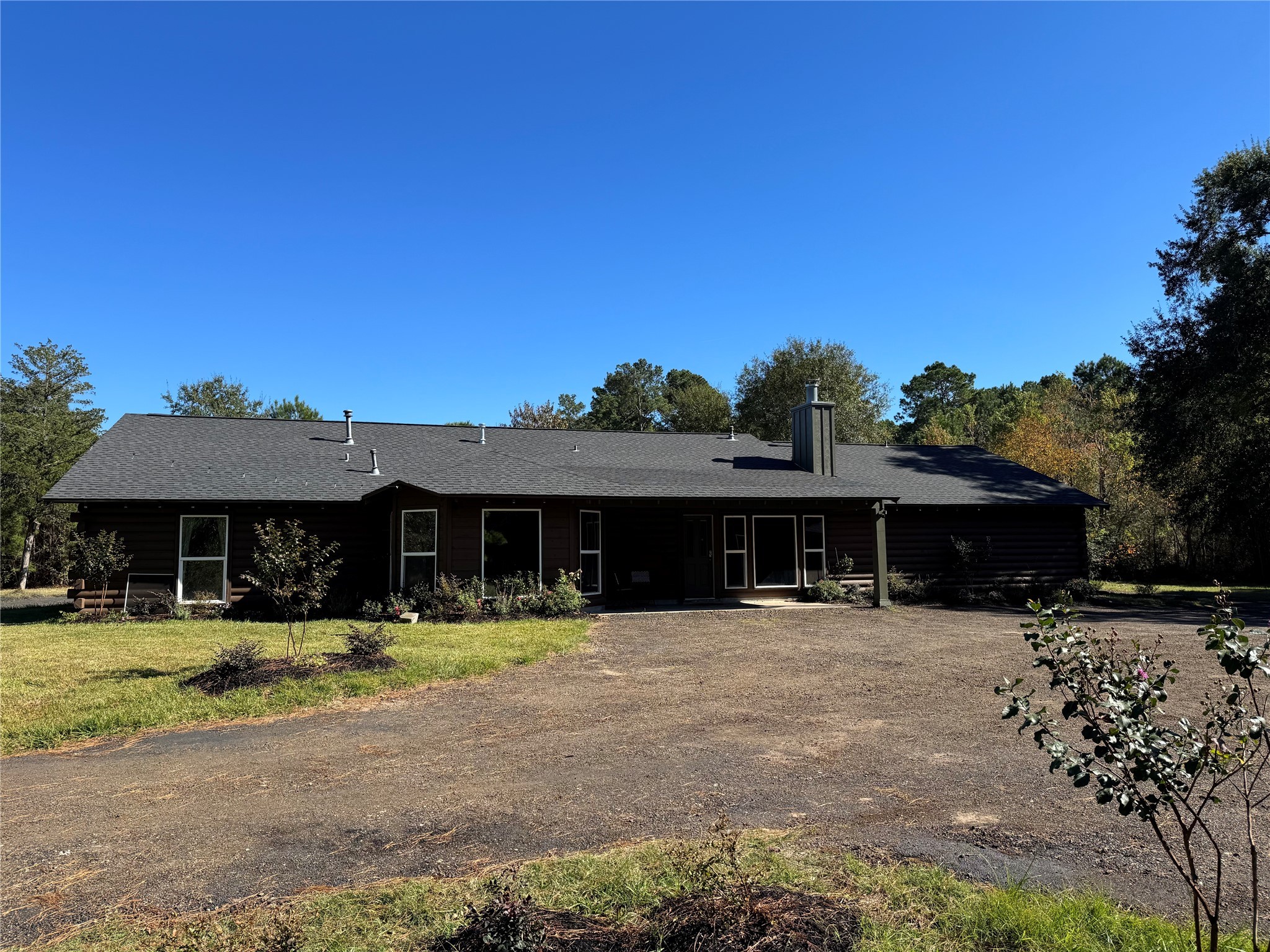24879 Macedonia Road Hockley, TX 77447 - Photo 3 of 32 a view of a table and chairs under an umbrella