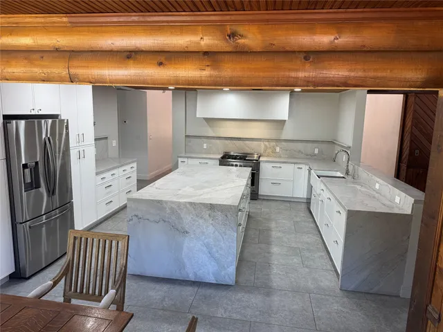a kitchen with a stove and a refrigerator