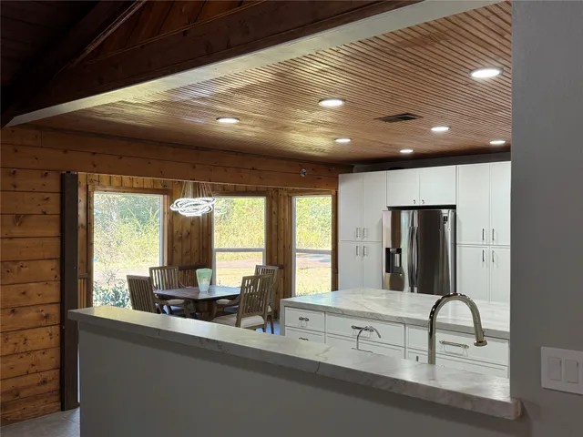 a view of a fireplace with an empty room