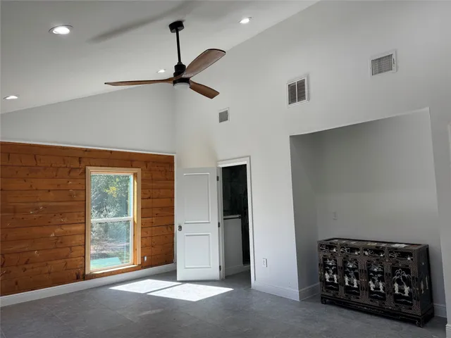 a bathroom with a granite countertop sink a large mirror and a