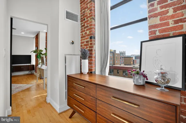 a kitchen with sink and large window