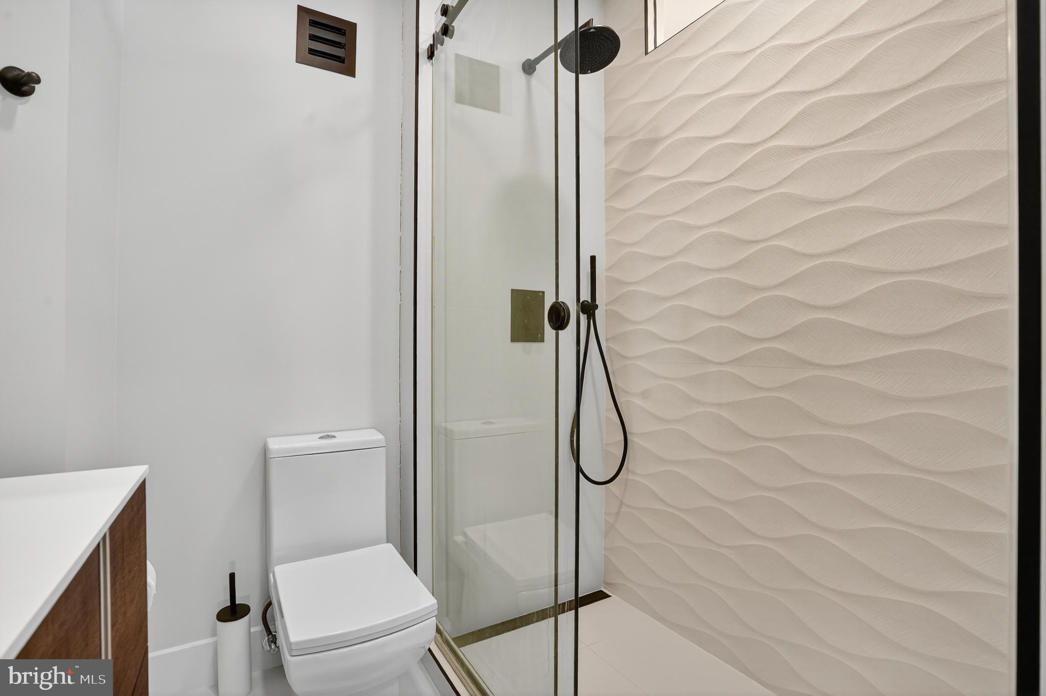 1615 Q Street Northwest, Unit 601 Washington, DC 20009 - Photo 16 of 21 a bathroom with a toilet and shower