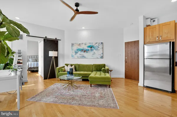 a living room with furniture and a rug