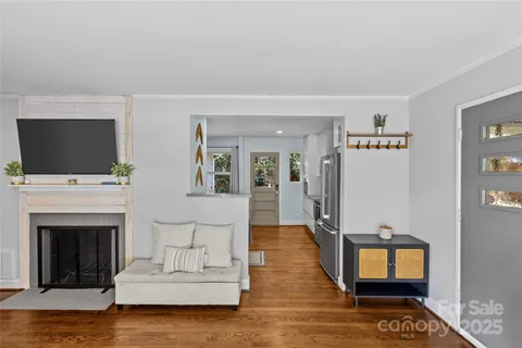 a kitchen with stainless steel appliances granite countertop a stove a refrigerator and a white cabinets