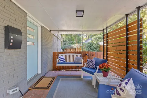 a living room with furniture fireplace and flat screen tv